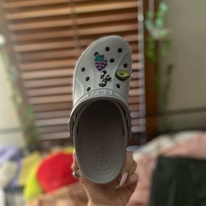 Grey crocs with pink writing